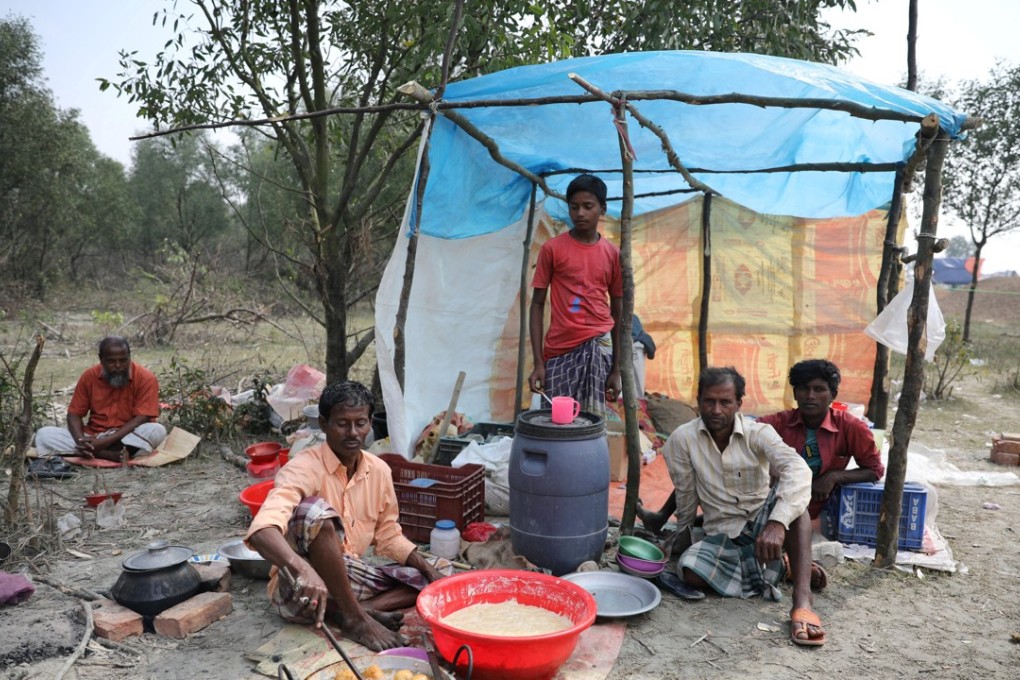 A man cooks a meal in his makeshift restaurant on the island of Bhasan Char in the Bay of Bengal, Bangladesh. Photo: Reuters