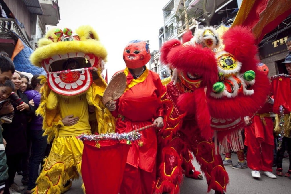 Dong Ky villagers perform a lion dance on the fourth day of Tet, or the Vietnamese Lunar New Year, in Dong Ky, Bac Ninh province, Vietnam. Picture: Luong Thai Linh