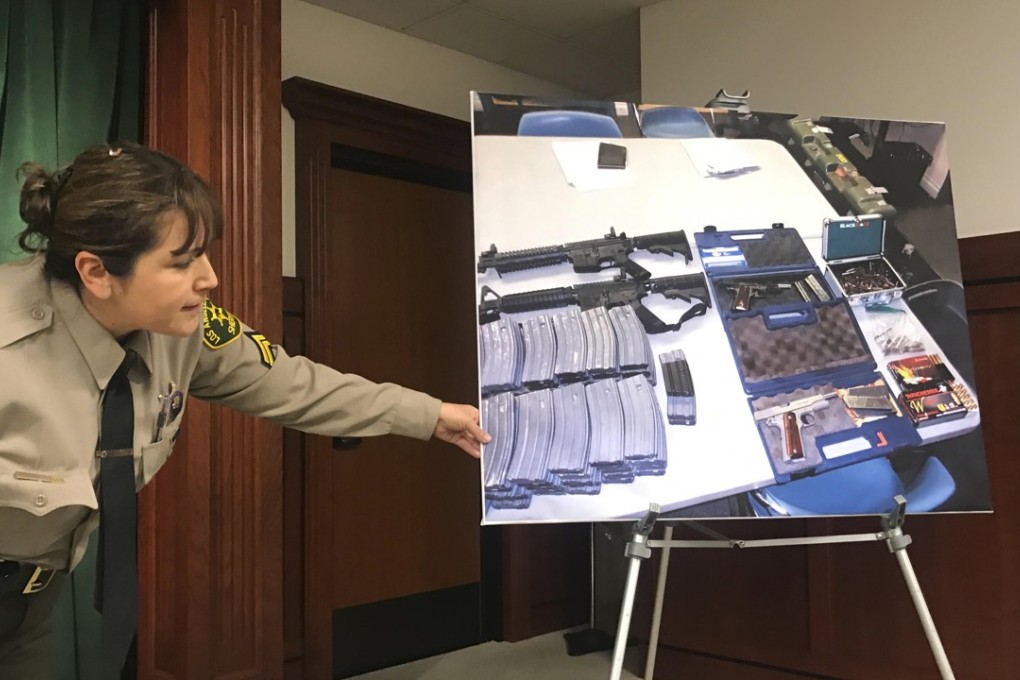 Deputy Lisa Jansen displays photos of weapons and ammo at a news conference in Los Angeles on Wednesday, after authorities said they had thwarted a student's plot for a mass shooting at a Southern California high school. Photo: AP