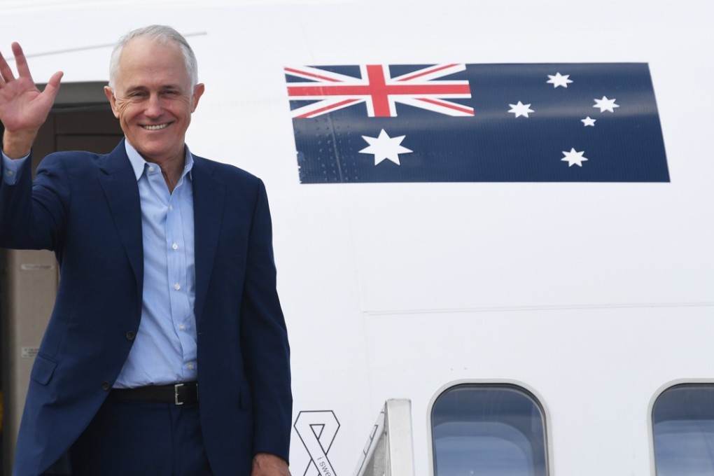 Australian Prime Minister Malcolm Turnbull waves as he boards a plane in Sydney bound for the US, where he will meet President Donald Trump. Photo: EPA