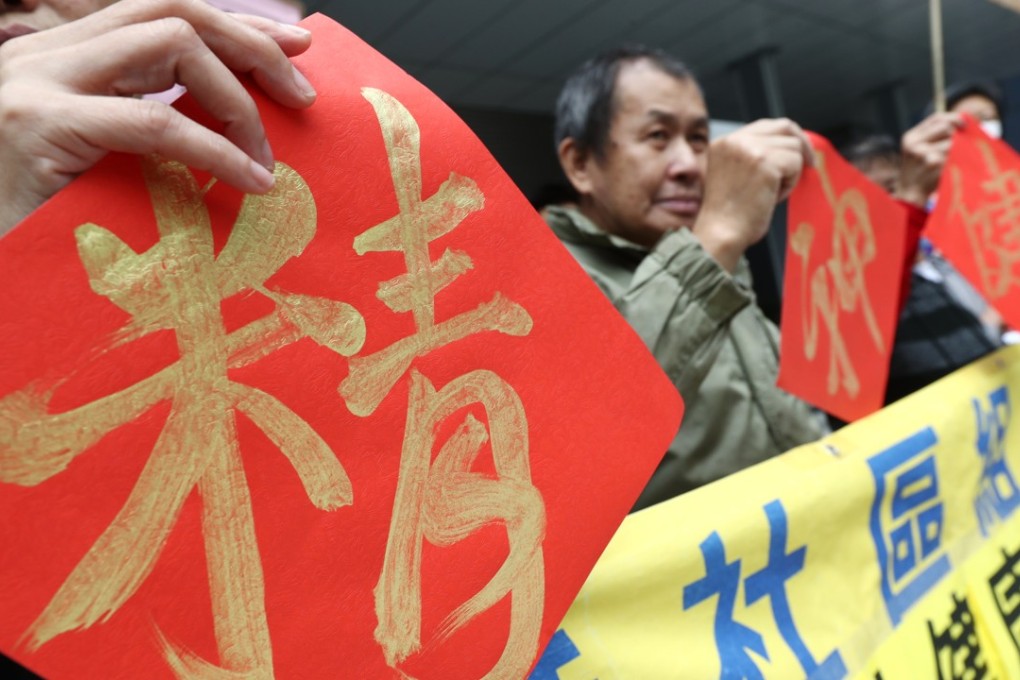 Mental health activist groups have lobbied the government for more funding. Members from the Hong Kong Society for Community Organisation and the Joint Committee for the Promotion of Mental Health hold up the Chinese characters that read 'Mental Health' at Tamar. Photo: Nora Tam