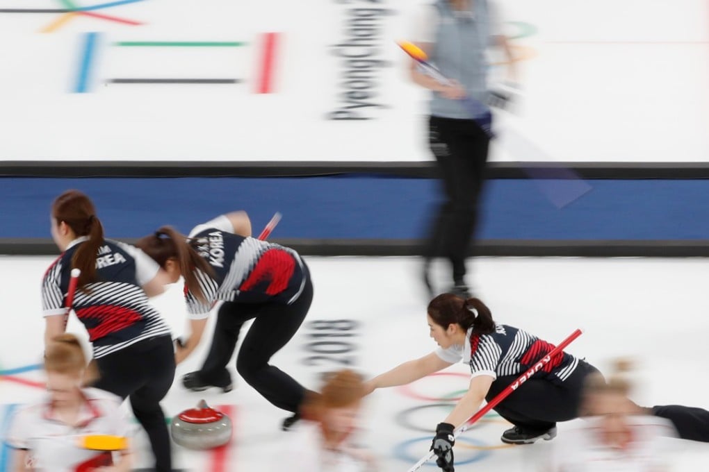 Vice-skip Kyeongae Kim of South Korea’s ‘Garlic Girls’ delivers a stone in their clash with Great Britain. Photo: Reuters