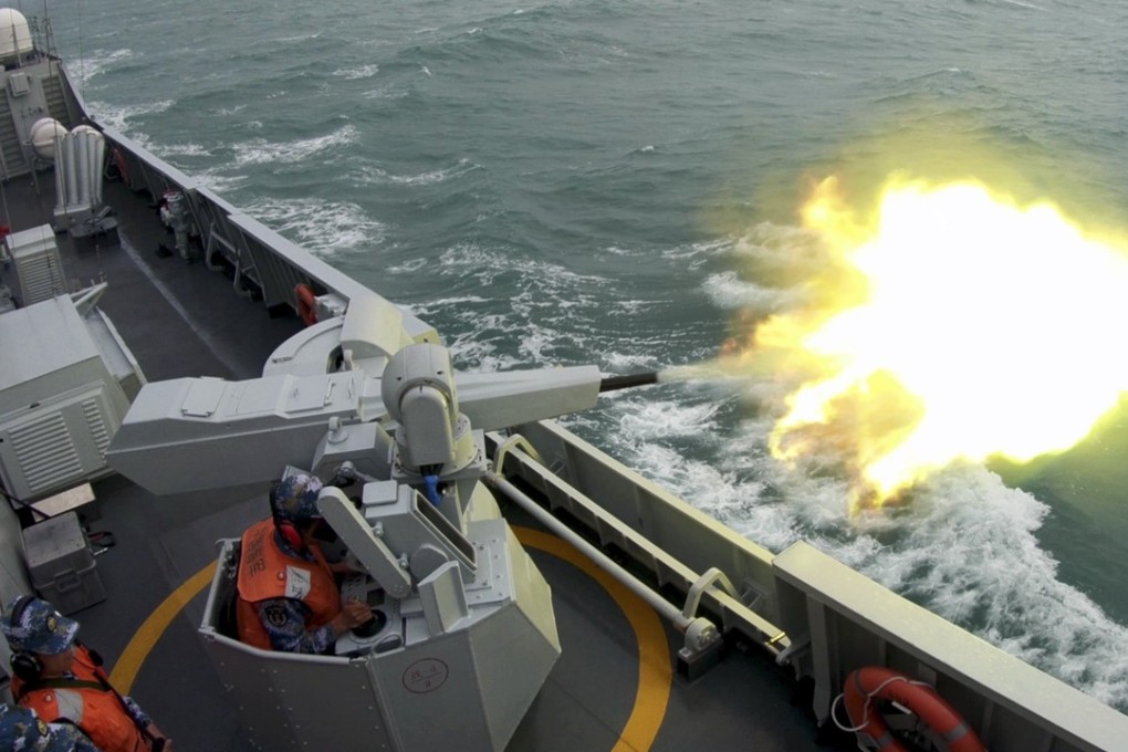 A guided-missile frigate attached to a frigate flotilla under the PLA Navy fires its close-in weapons system during a maritime live-fire training, in the South China Sea last December. Photo: China Military