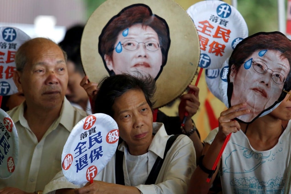 Protesters call for a universal pension scheme, as Chief Executive Carrie Lam Cheng Yuet-ngor prepares to deliver her first policy address, outside the Legislative Council in Hong Kong on October 11. Photo: Reuters