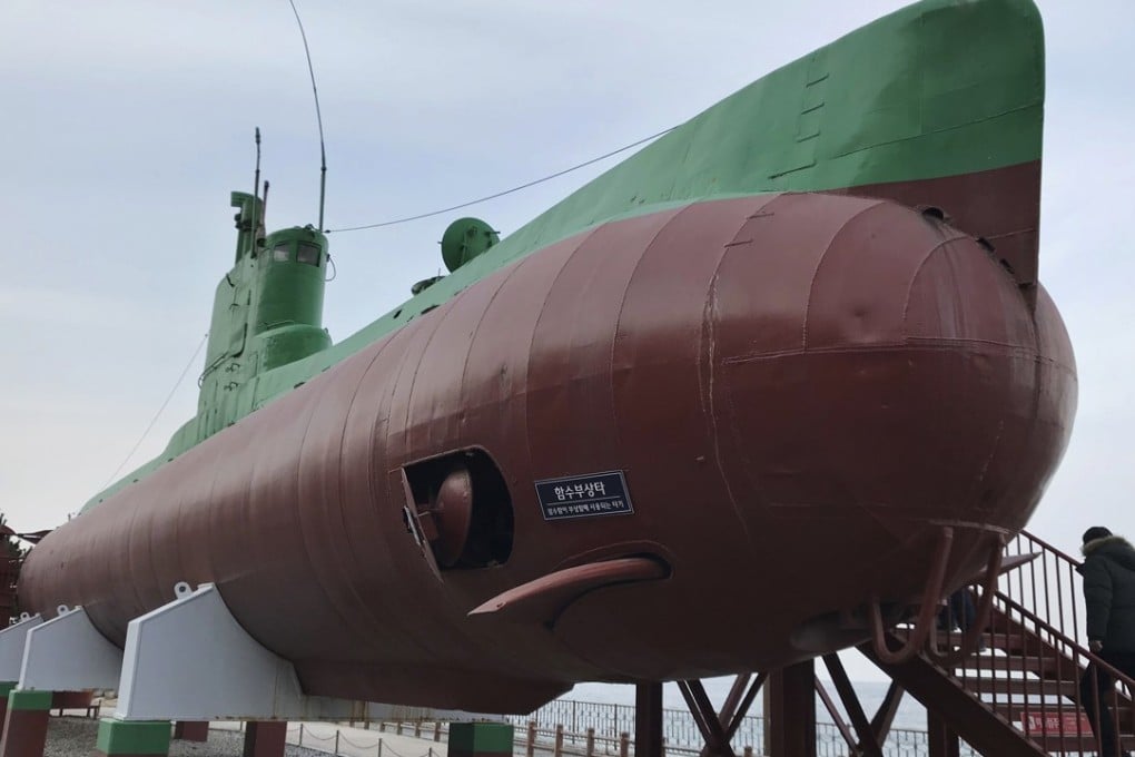 Visitors board a North Korean submarine on display at the seaside Unification Park in Gangneung. Photo: AP