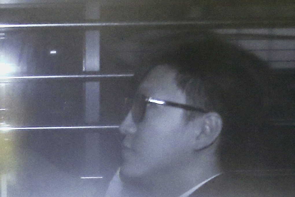 Activist Edward Leung Tin-kei is escorted to the High Court in Admiralty. Photo: David Wong