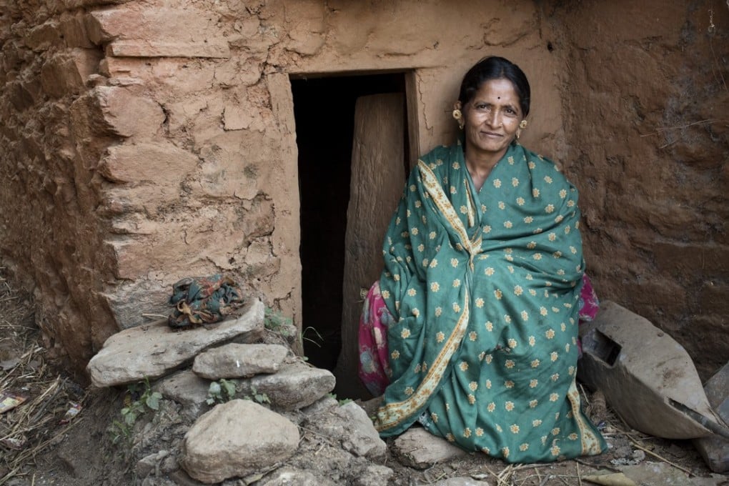 Ganga Kunwar in front of her hut, or goth, in Payal, Achham. Pictures: Miguel Candela