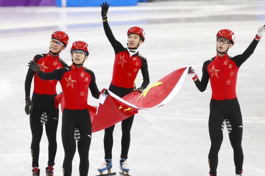 Olympic silver medallists Wu Dajing (right) Han Tianyu (second left) Chen Dequan (left) and Xu Hongzhi (second right) of China react after the short track speedskating 5,000m relay final. Photo: EPA