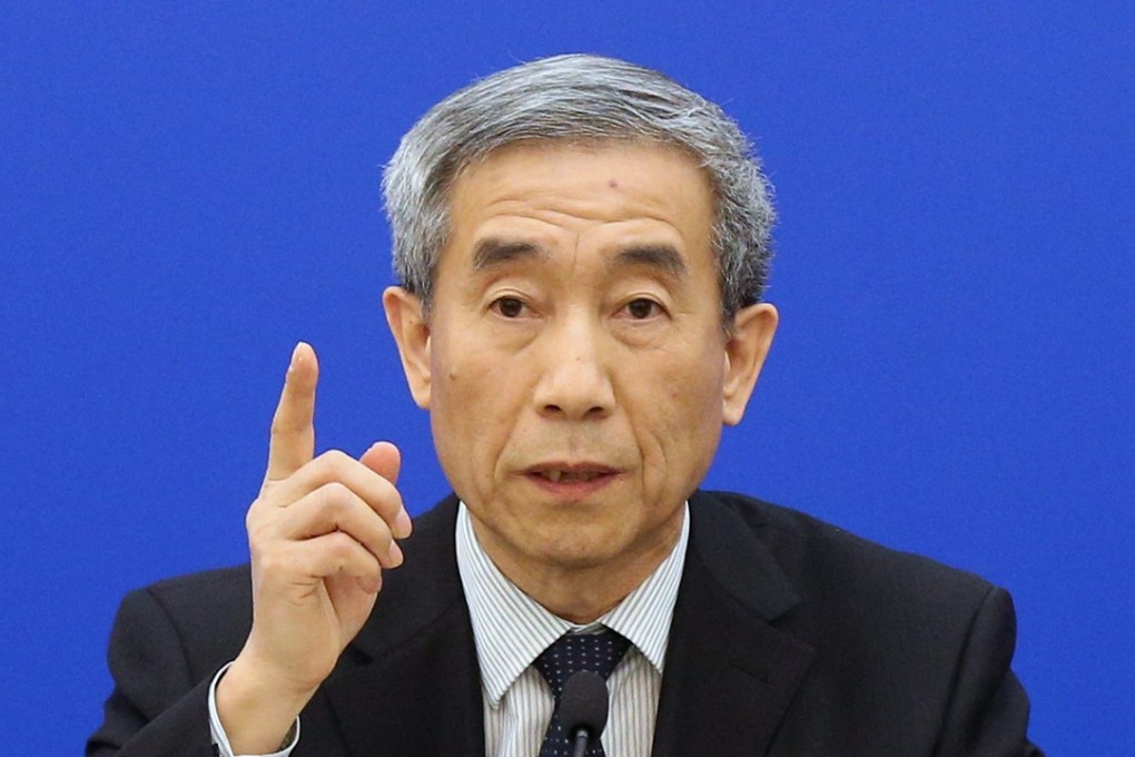 Li Fei was speaking to the press on his way to an NPCSC meeting. Photo: EPA