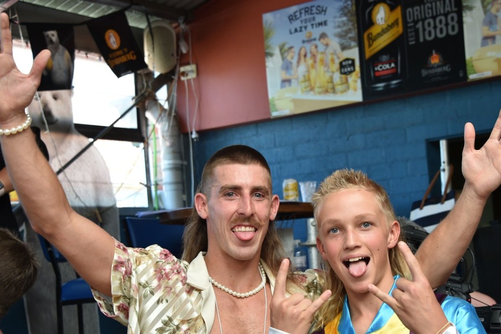 People show off their mullet haircuts at Mulletfest 2018 in the town of Kurri Kurri, 150km north of Sydney on February 24, 2018. Photo: AFP