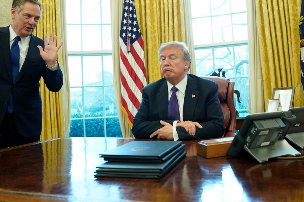 Donald Trumps listens to US trade representative Robert Lighthizer. Photo: Reuters