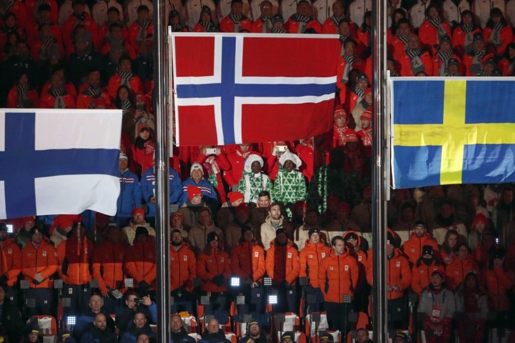 Flags of Finland, Norway and Sweden fly during the closing ceremony of the Pyeongchang Winter Olympics. Photo: Reuters