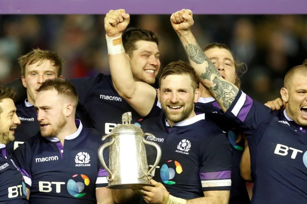 Scotland’s John Barclay celebrates with teammates and the Calcutta Cup trophy after the win over England. Photo: Reuters