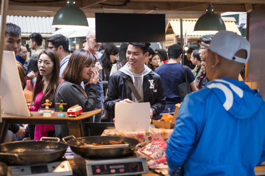 A street market in Quarry Bay. When asked what the city had to offer expats, 36 per cent of Hong Kong respondents cited the quality of food. Photo: Christopher DeWolf