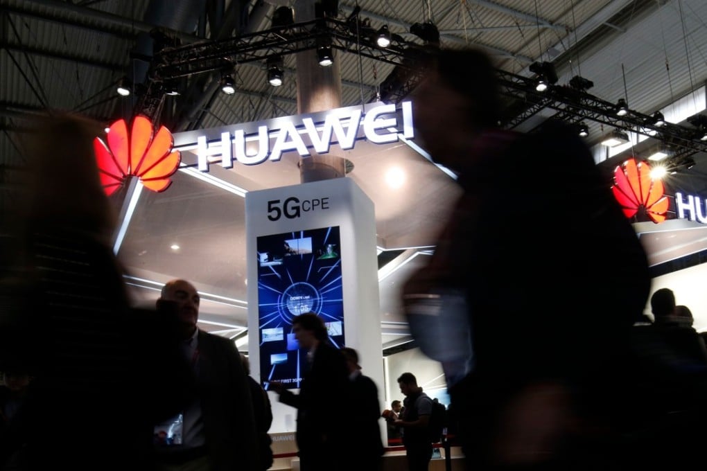 People walk by the Huawei stand at the Mobile World Congress (MWC), the world's biggest mobile fair, on February 26, 2018 in Barcelona. The Mobile World Congress is held in Barcelona from February 26 to March 1. Photo: AFP