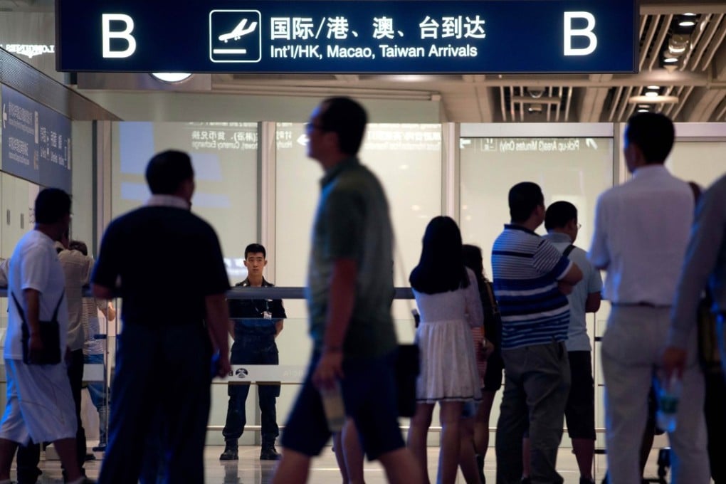 The arrivals area at Beijing Capital International Airport. Some Chinese dual passport holders fear returning to their country of birth. Photo: AFP