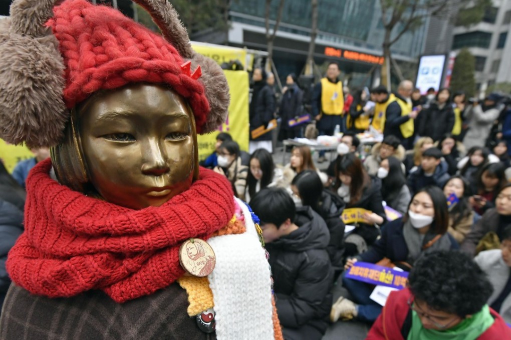 People protesting near the ‘comfort women’ statue outside the Japanese embassy in Seoul on February 14, 2018. Photo: Kyodo