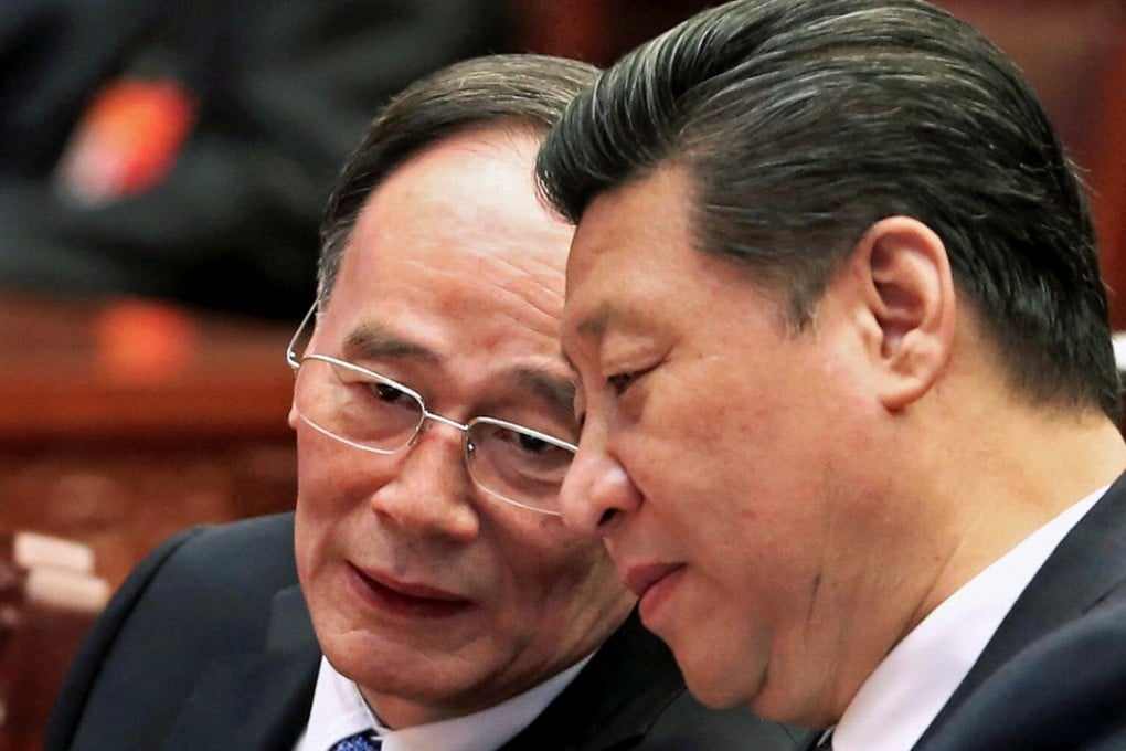 China's President Xi Jinping (R) speaks to Wang Qishan, the head of China's anti-corruption watchdog in Beijing March 4, 2015. Picture taken March 4, 2015. Photo: Reuters