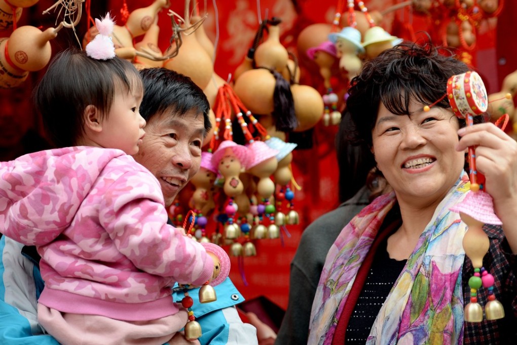 Data from the recently ended Spring Festival celebrations showed that China’s consumer part of the economy is buoyant. Above, a family attends a temple fair at Xiaoyan Pagoda in Xi’an, capital of northwest China’s Shaanxi province, to celebrate the Lunar New Year. Photo: Xinhua