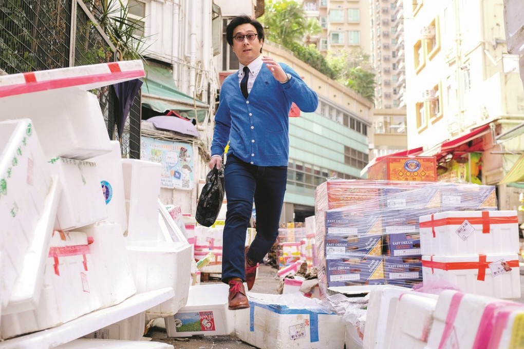 Dr Christopher See, a lecturer at HKU, demonstrating his daily exercise workout which involves dodging pedestrians and jumping over obstacles in the Wan Chai Market on his way to work. Photo: Antony Dickson