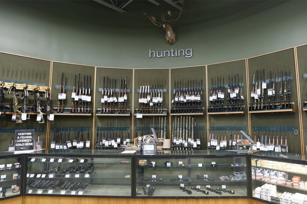 Guns on display at the Dick's Sporting Goods in Danvers, Massachusetts, on Wednesday. Two weeks after the shooting that killed 17 people at Marjory Stoneman Douglas High School in Parkland, Florida, Dick’s has announced that it would no longer sell assault rifles and will raise the minimum age requirement to 21 for all gun purchases. Photo: EPA-EFE