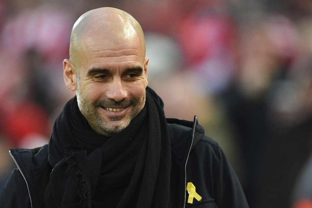 Manchester City manager Pep Guardiola has agreed to stop wearing the yellow ribbon in support of Catalonia protests at the request of the club. Photo: AFP