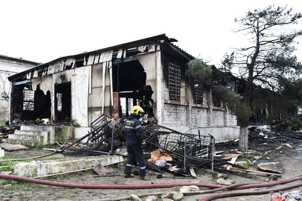 An Azerbaijani firefighter at the site of a drug rehabilitation centre in Baku that was gutted by fire. Photo: EPA