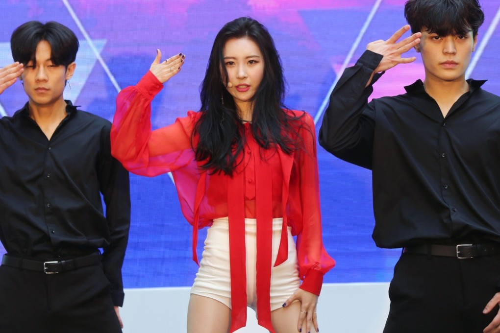 South Korean singer Lee Sun-mi (centre), also known as Sunmi and a former member of K-pop group Wonder Girls, performs at messaging app operator Line's product launch in Hong Kong. Photo: Xiaomei Chen