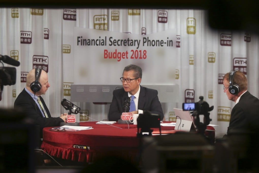 Financial Secretary Paul Chan Mo-po (centre) speaks on a radio phone-in show about the 2018-19 budget. Photo: Xiaomei Chen