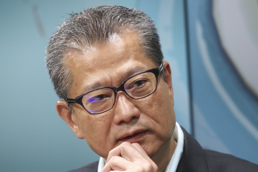 Financial Secretary Paul Chan remains firm on his stance on not giving cash handouts to all. Photo: Edward Wong