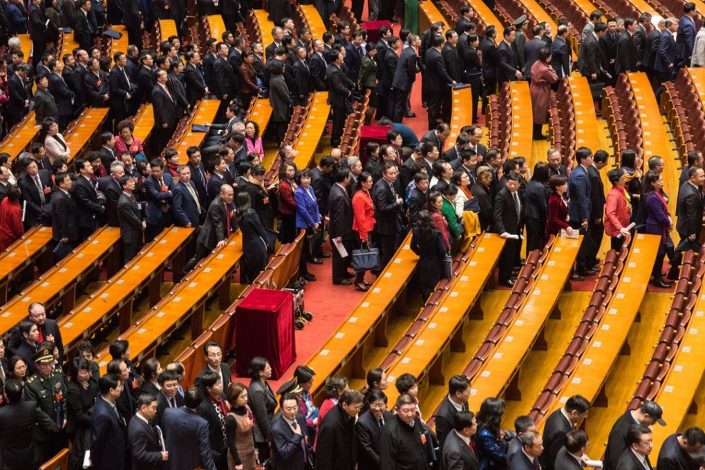 Delegates file out of the Great Hall of the People after the opening session of the CPPCC on Saturday. Photo: EPA-EFE