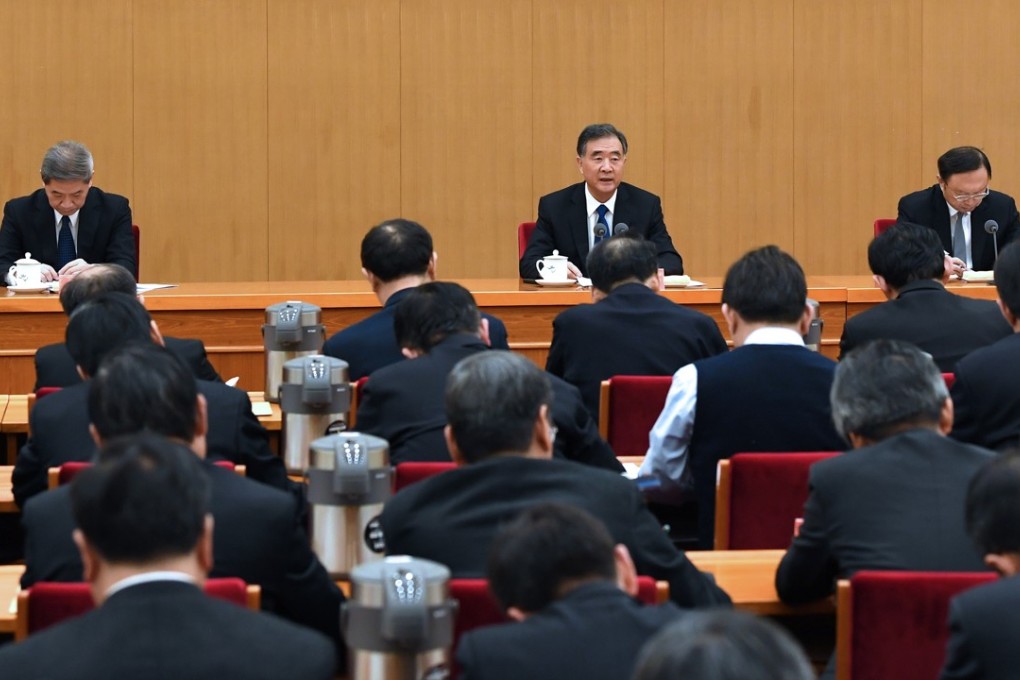 Politburo Standing Committee member Wang Yang (centre) speaks at an annual meeting of central and local officials in charge of Taiwan affairs in Beijing last month. Photo: Xinhua