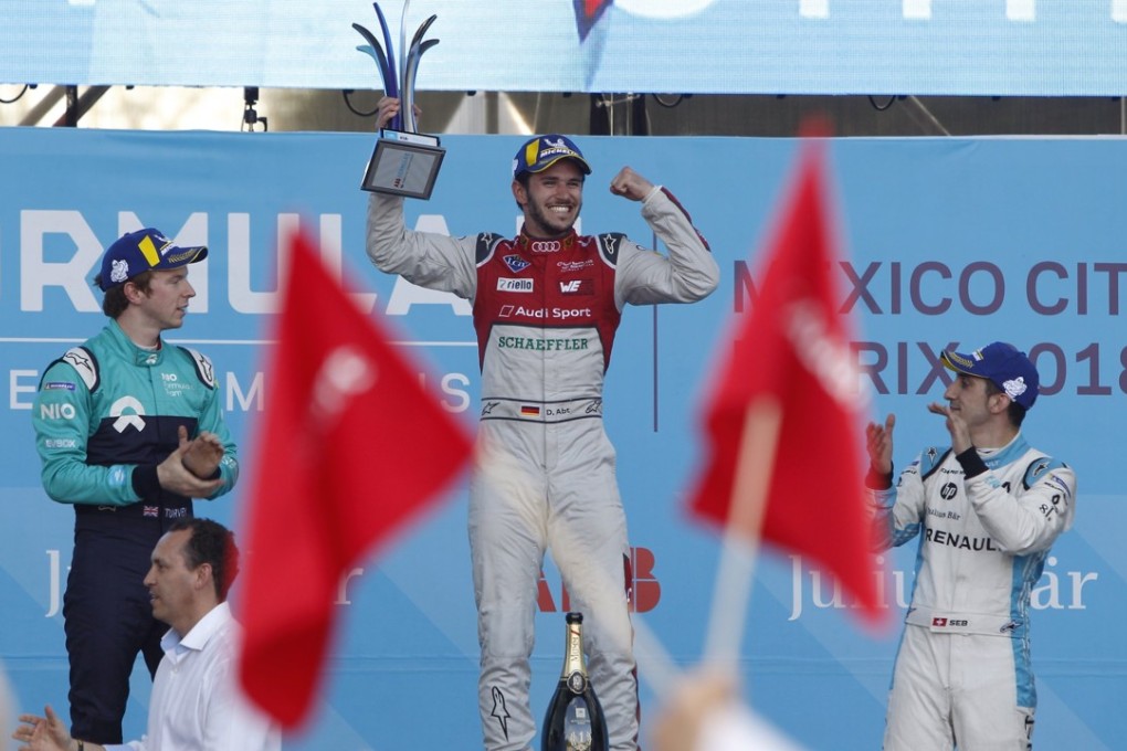 German driver Daniel Abt (centre) celebrates winning the 2018 Mexico City E-Prix at the Hermanos Rodriguez racetrack in Mexico City. Photo: EPA