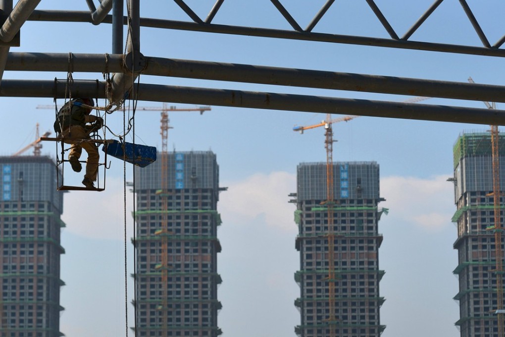 A construction site of an amusement park next to new property buildings in Hefei in Anhui province on August 1, 2015. The city in eastern China is among the seven cities that occupy the world’s top 10 cities with the fastest-rising residential property prices last year, according to Hurun Report. Photo: Reuters