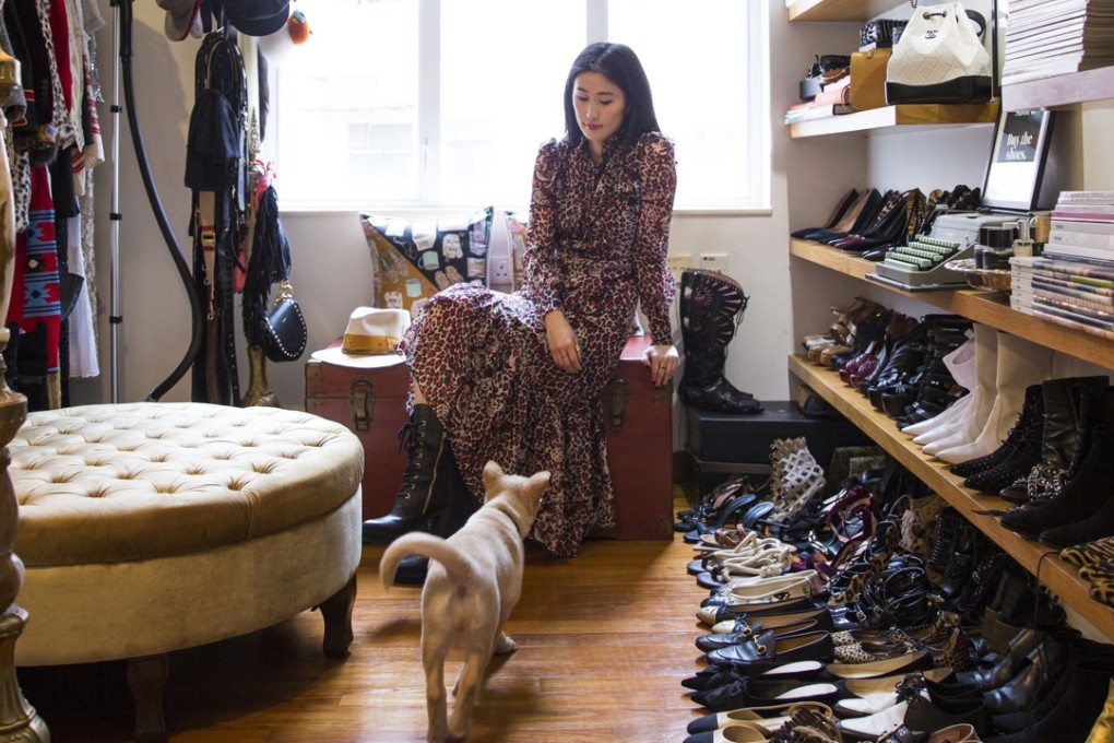 Justine Lee at home wearing a dress by Saint Laurent and boots by Tod’s. Photo: Michelle Wong
