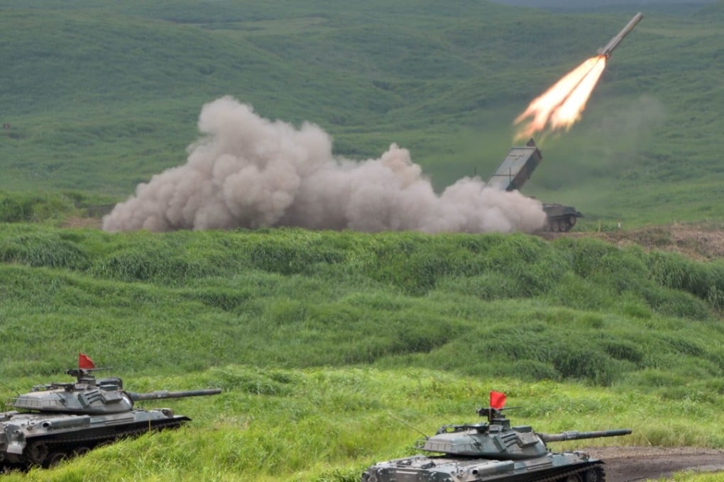 File photo of a Japanese military type-92 anti-mine rocket launcher firing a missile during exercises at the Higashi-Fuji firing range in Gotemba. Photo: AFP