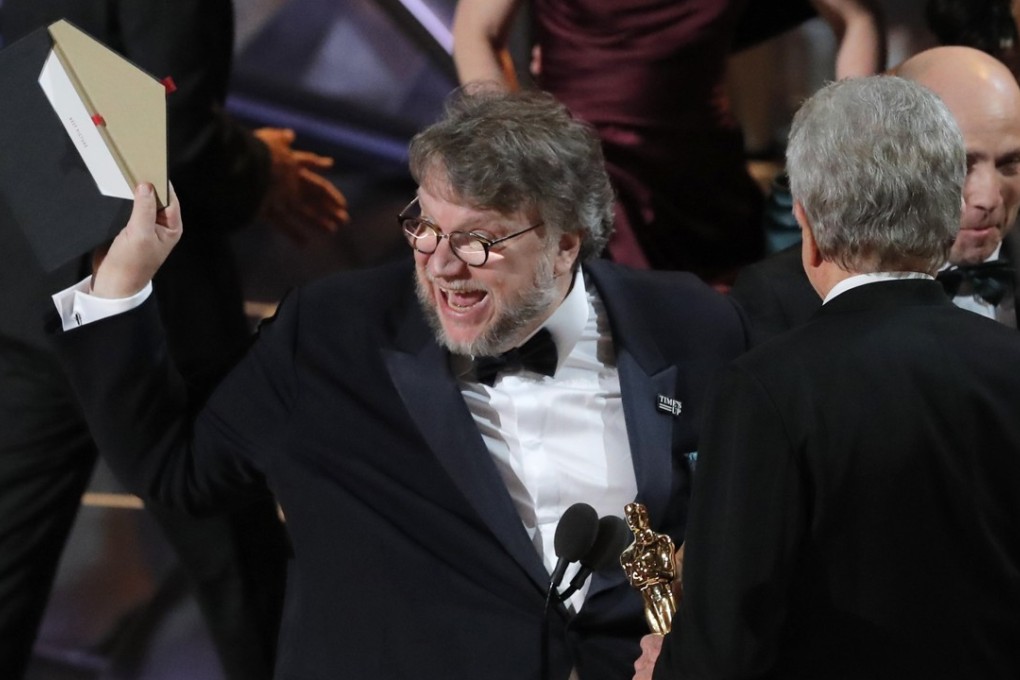 Guillermo del Toro accepts the Oscar for Best Picture for "The Shape of Water" from presenter Warren Beatty. Photo: Reuters