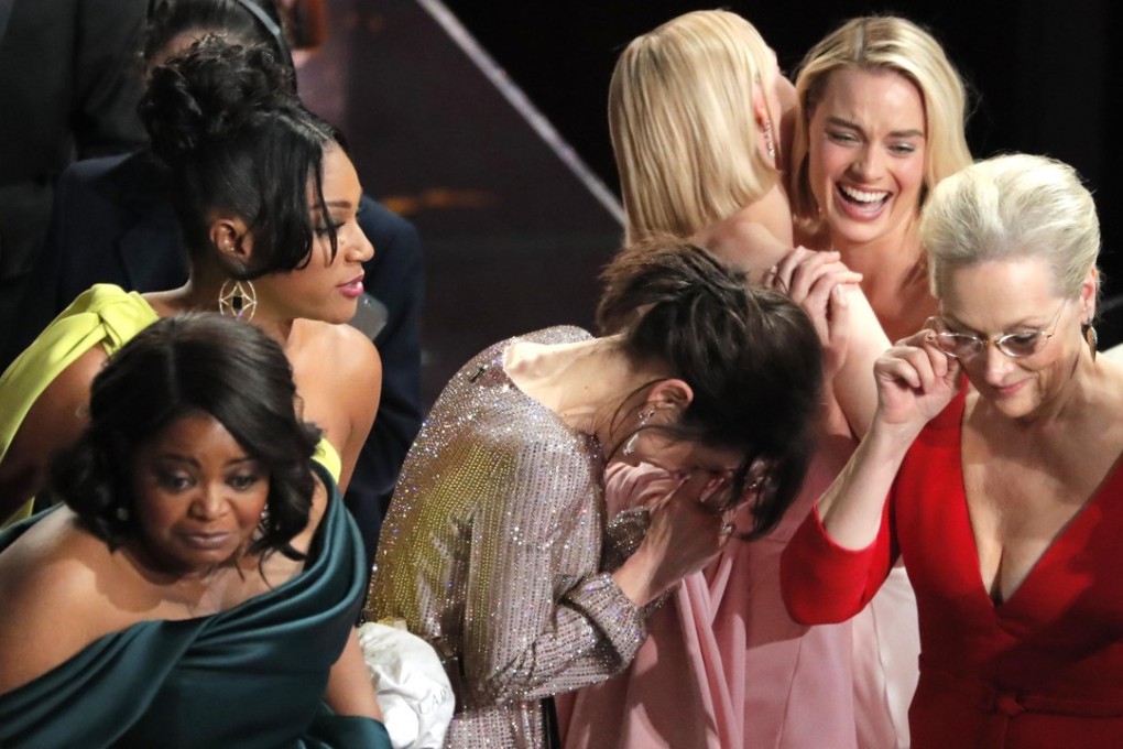 Actresses (from left) Octavia Spencer, Tiffany Haddish, Sally Hawkins, Saoirse Ronan, Margot Robbie and Meryl Streep react to Frances McDormand's best actress acceptance speech, in which she asked women in the audience to stand. Photo: Reuters
