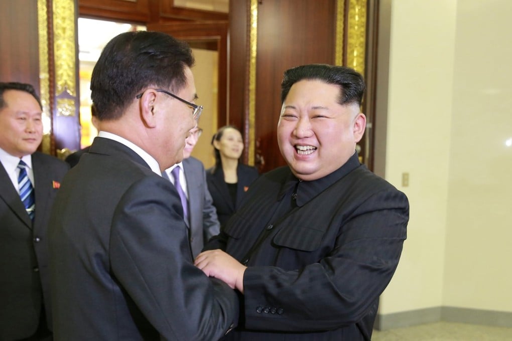 North Korean leader Kim Jong-un greets Chung Eui-yong, a member of the special delegation sent by South Korea's president, at a dinner in Pyongyang on Monday night, in this photo released by North Korea's Korean Central News Agency. Photo: Reuters