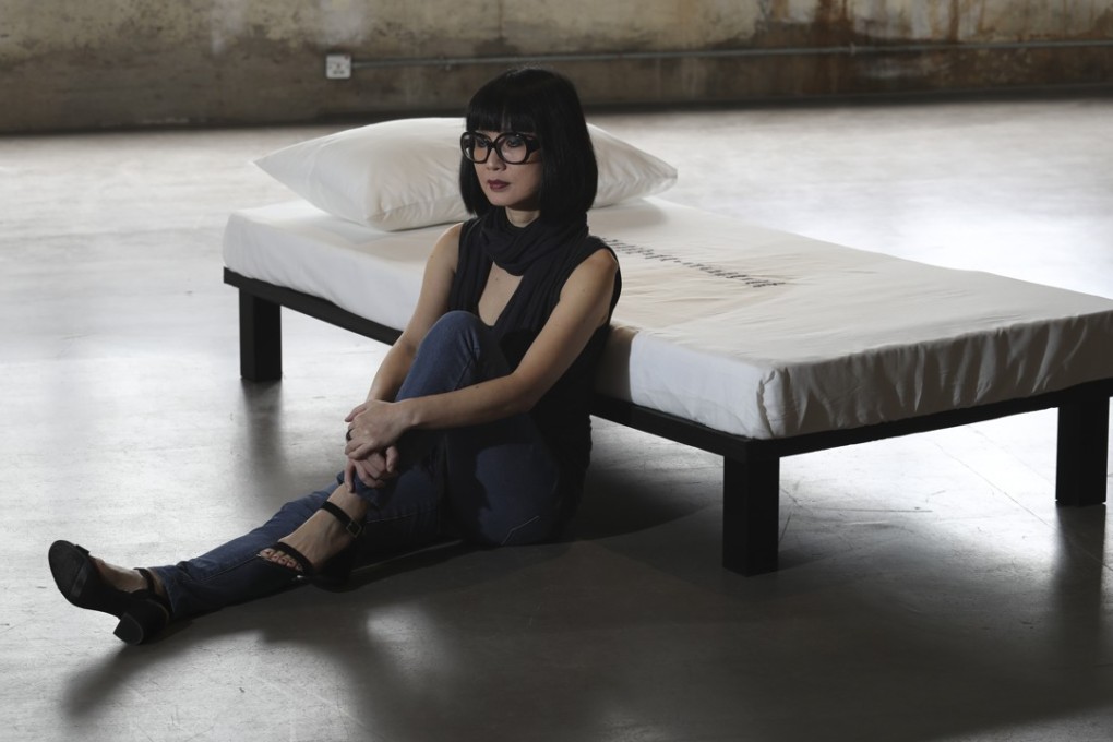 Artist Angela Su with her artwork “My Sincere Apologies”. Women are under-represented in solo exhibitions in Hong Kong. Photo: Nora Tam