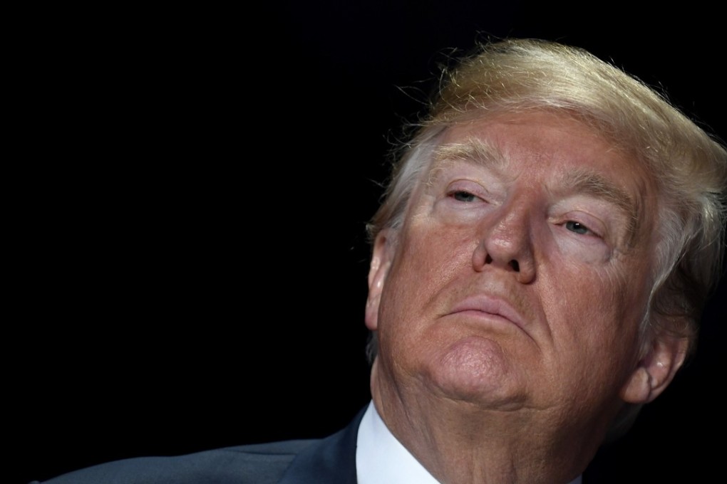 US President Donald Trump listens during the National Prayer Breakfast in Washington on February 8. Trump used his speech to praise the US military and reiterate support for oppressed people in Iran and North Korea. Photo: Bloomberg