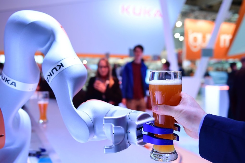 A robot made by Kuka serves beer at the Hanover Fair last April. Midea paid US$5 billion to take over Kuka in 2016. Photo: AFP