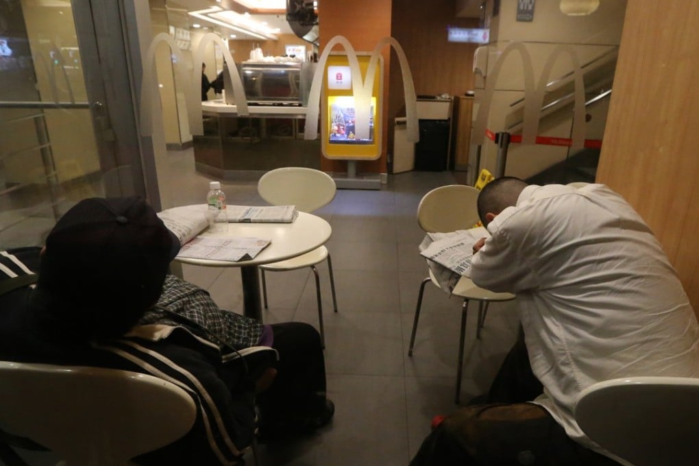 Homeless people asleep at a McDonald’s in Mong Kok. Photo: Felix Wong