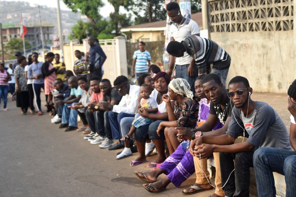 People wait to cast their vote during Sierra Leone's presidential election in Freetown. Photo: Reuters