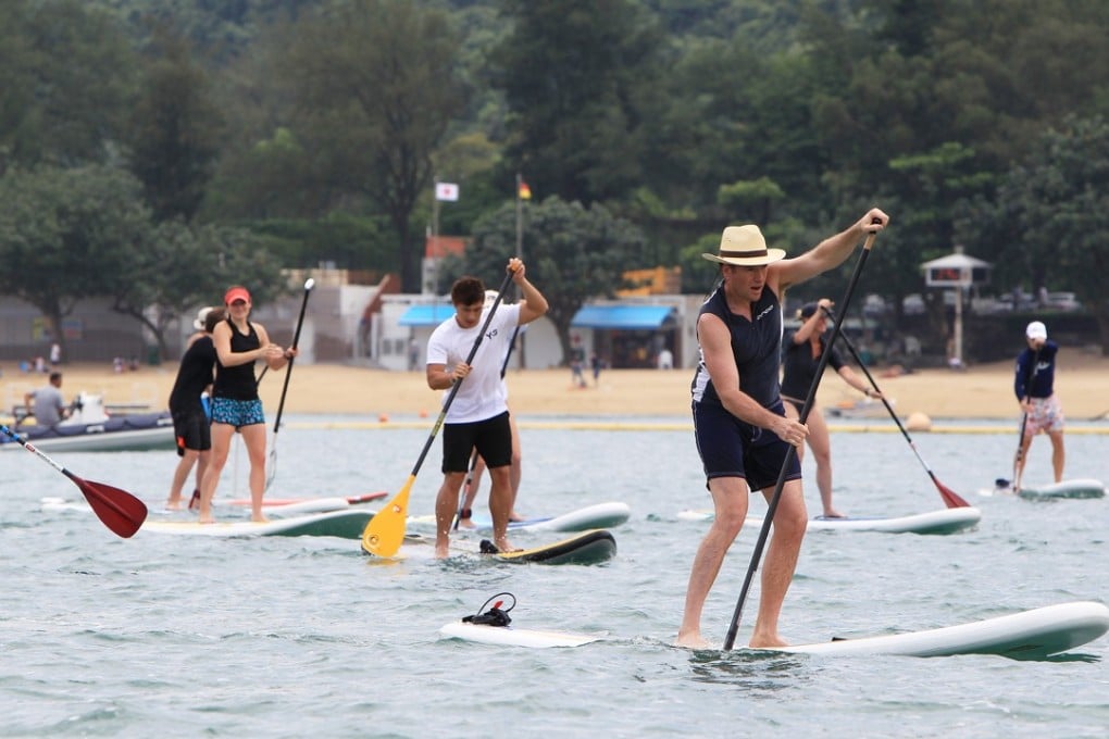 Stand-up paddlers participate in an event held at the Victoria Recreation Club in Deep Water Bay. The club is a base for outrigger canoeing, dragon boating and paddle boarding. Photo: Jonathan Wong