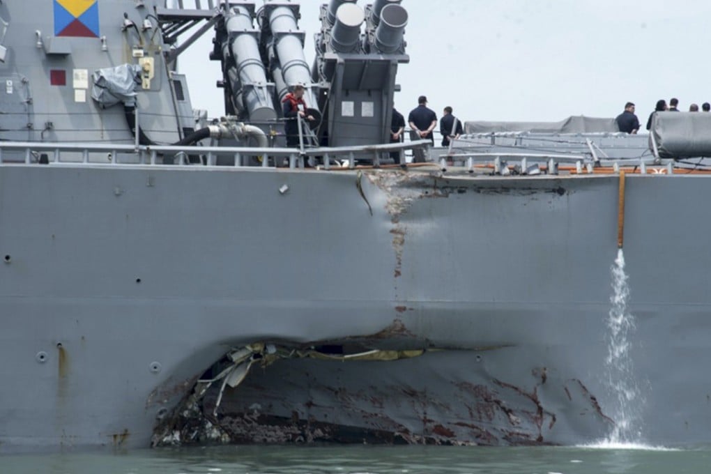 Guided-missile destroyer USS John S. McCain was seriously damaged when it collided an oil tanker off Singapore last year, killing 10 sailors. Photo: AP