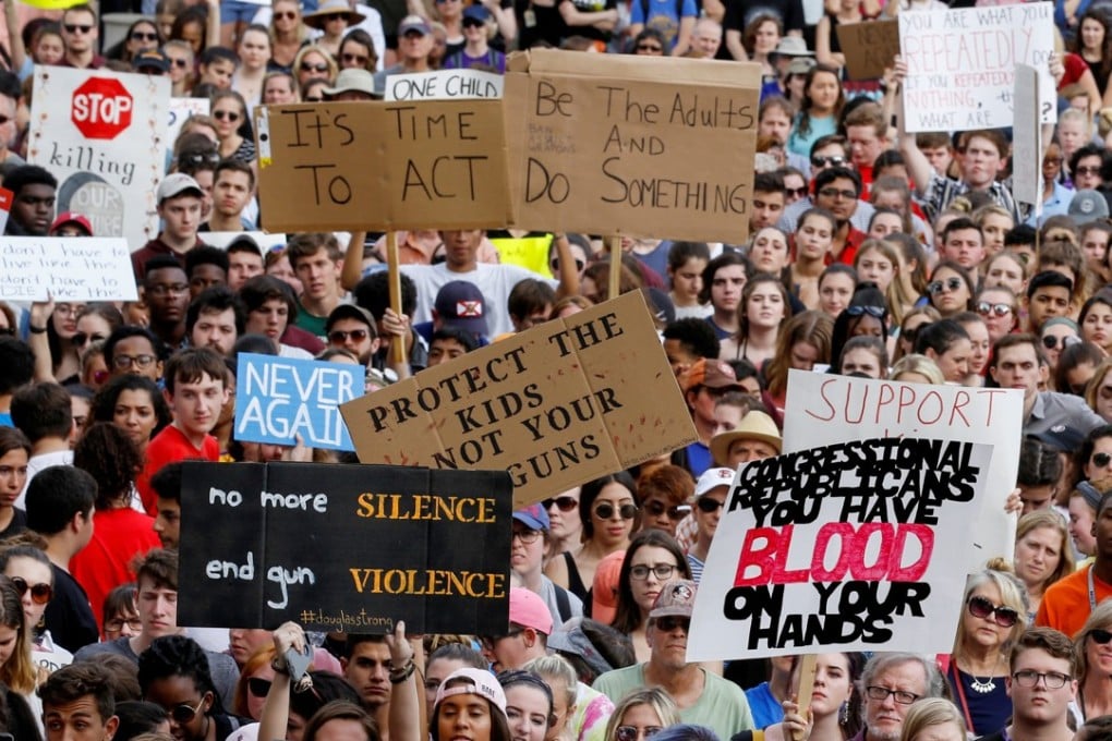 Protesters rally outside the Florida Capitol building in Tallahassee on February 21 urging lawmakers to reform gun laws, in the mass shooting at Marjory Stoneman Douglas High School. Photo: Reuters