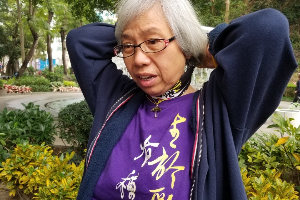 Alexandra Wong, 61, was in the lobby of the court building watching the live stream of the hearing. Photo: Chris Lau