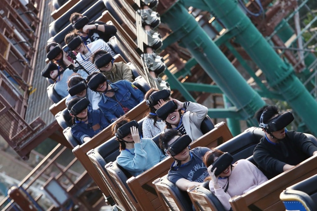Members of the press sample Hong Kong’s first virtual reality roller-coaster at Ocean Park in December 2017. The government announced that it plans to inject HK$310 million into the park. Photo: Nora Tam