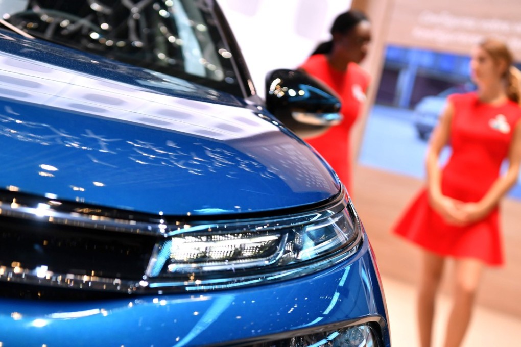 Hostesses stand at the Citroen booth ahead of the Geneva International Motor Show on March 6. Photo: AFP